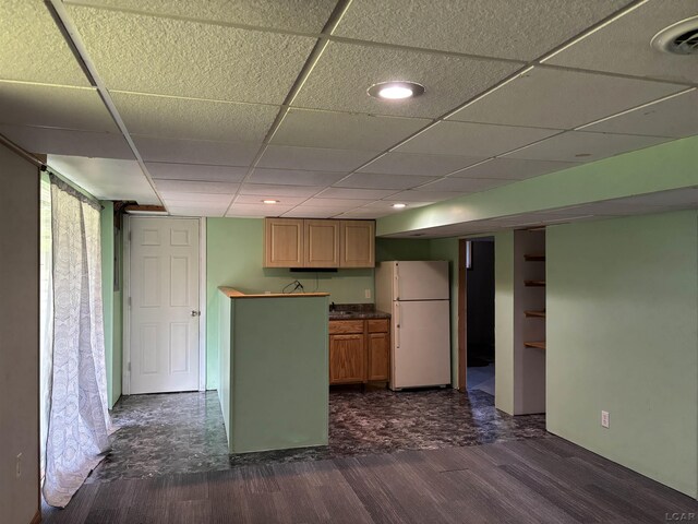 6143 Shepherd Rd, Adrian, MI 49221 - kitchen featuring freestanding refrigerator, dark countertops, and a paneled ceiling