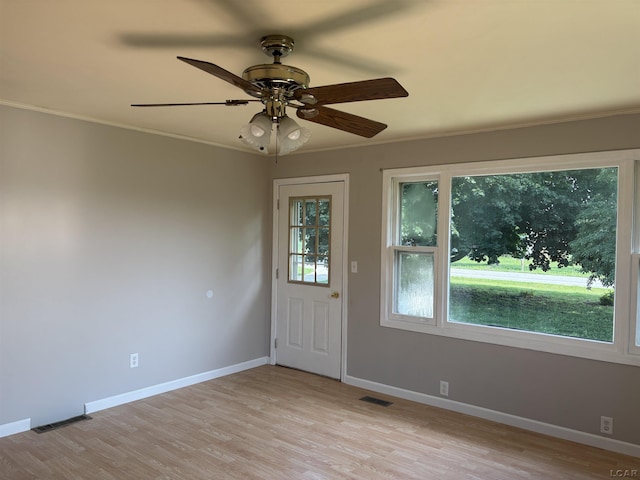 6143 Shepherd Rd, Adrian, MI 49221 - spare room with ornamental molding, light wood-style flooring, and ceiling fan