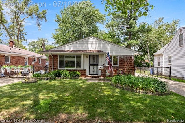 25416 Yale St S, Dearborn Heights, MI 48125 - bungalow-style house with brick siding and board and batten siding