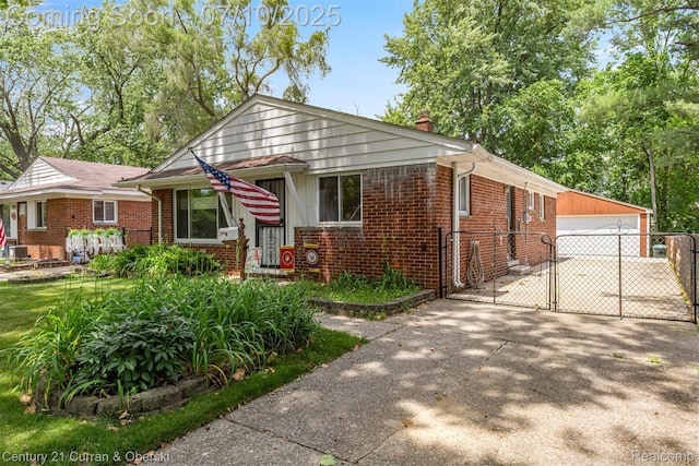 25416 Yale St S, Dearborn Heights, MI 48125 - bungalow featuring brick siding, a gate, an outdoor structure, a detached garage, and a chimney