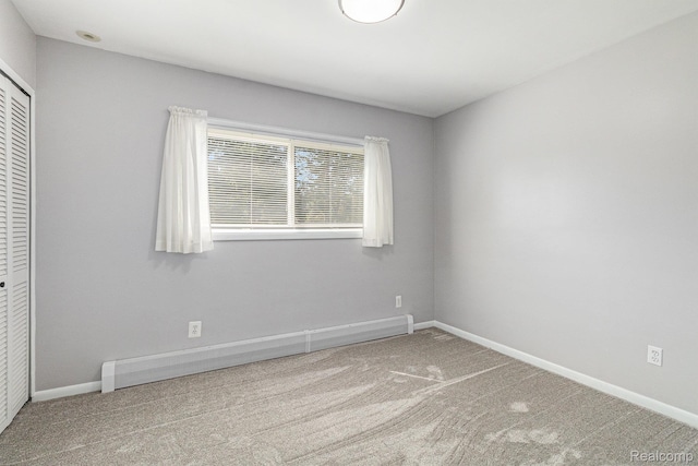 2145 Helmsford Dr, Wolverine Lake, MI 48390 - unfurnished bedroom featuring carpet, a closet, and a baseboard radiator