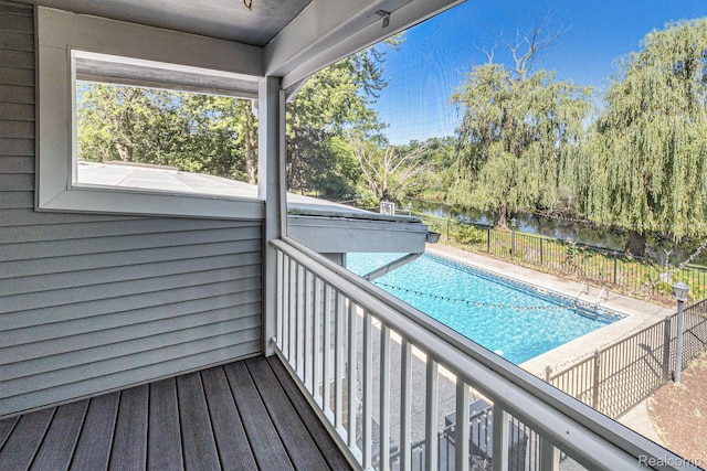 2145 Helmsford Dr, Wolverine Lake, MI 48390 - balcony featuring a water view, view of pool, and view of scattered trees