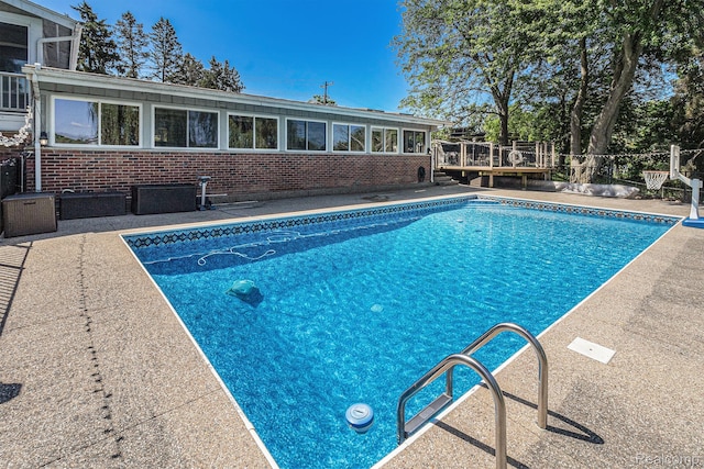 2145 Helmsford Dr, Wolverine Lake, MI 48390 - swimming pool with a wooden deck