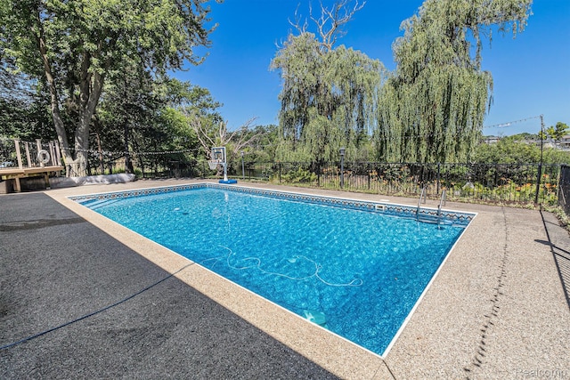 2145 Helmsford Dr, Wolverine Lake, MI 48390 - view of swimming pool with a patio area
