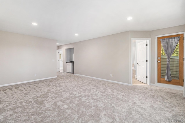 2145 Helmsford Dr, Wolverine Lake, MI 48390 - empty room with light carpet and recessed lighting