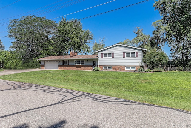 2145 Helmsford Dr, Wolverine Lake, MI 48390 - split level home with a garage, driveway, a chimney, and brick siding