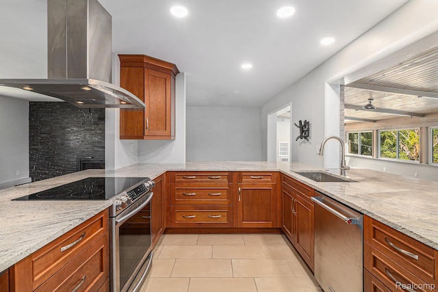 2145 Helmsford Dr, Wolverine Lake, MI 48390 - kitchen with island range hood, appliances with stainless steel finishes, light stone counters, recessed lighting, and a peninsula