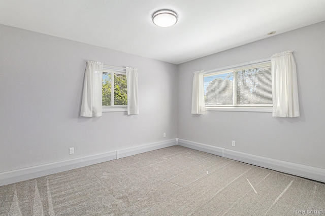 2145 Helmsford Dr, Wolverine Lake, MI 48390 - carpeted empty room featuring baseboards