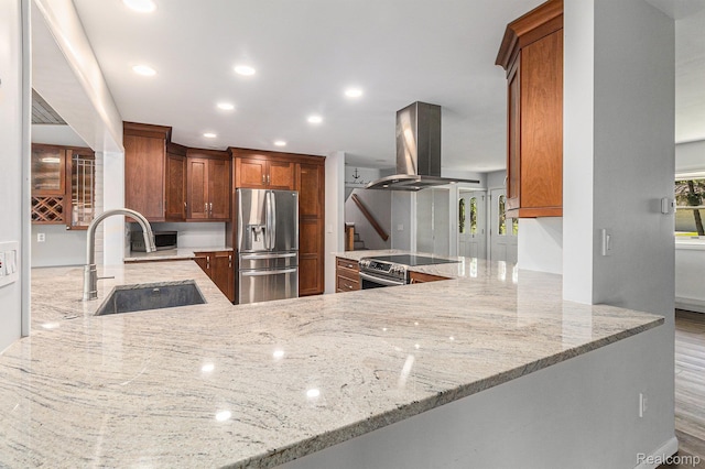 2145 Helmsford Dr, Wolverine Lake, MI 48390 - kitchen with stainless steel appliances, island range hood, light stone counters, and recessed lighting