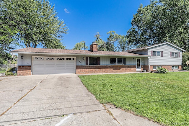 2145 Helmsford Dr, Wolverine Lake, MI 48390 - tri-level home with a chimney, brick siding, a garage, a front lawn, and concrete driveway
