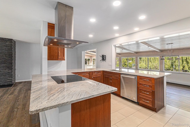 2145 Helmsford Dr, Wolverine Lake, MI 48390 - kitchen with stainless steel dishwasher, island range hood, a peninsula, light stone countertops, and black electric stovetop