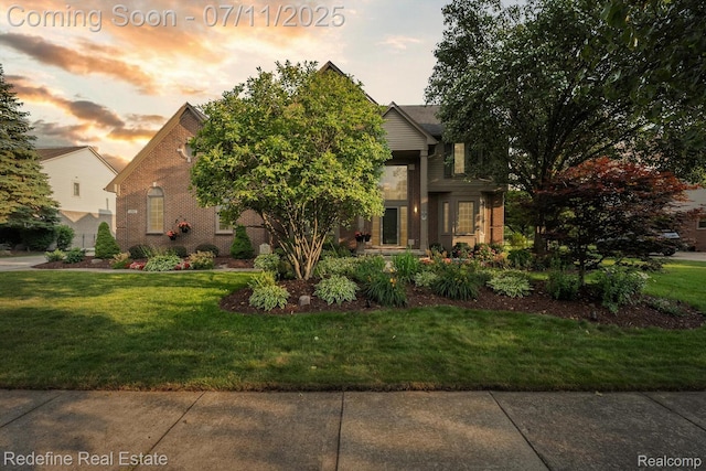 47451 Wallingford Ct, Canton, MI 48188 - view of front of property featuring brick siding and a yard