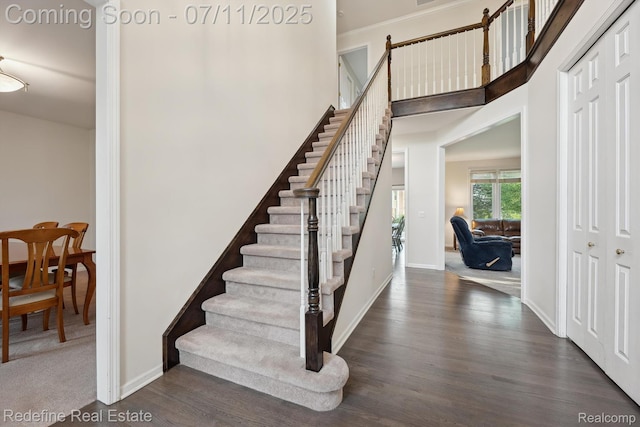 47451 Wallingford Ct, Canton, MI 48188 - stairway with wood finished floors, crown molding, and a towering ceiling
