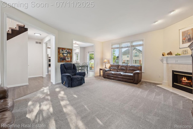 47451 Wallingford Ct, Canton, MI 48188 - carpeted living area featuring a tile fireplace and baseboards