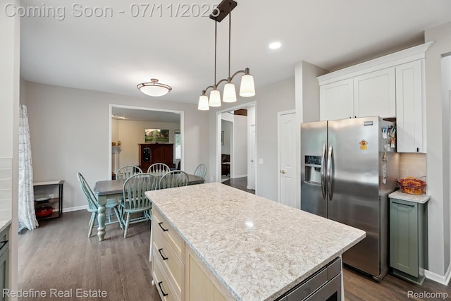 47451 Wallingford Ct, Canton, MI 48188 - kitchen featuring stainless steel refrigerator with ice dispenser, dark wood finished floors, a kitchen island, tasteful backsplash, and hanging light fixtures