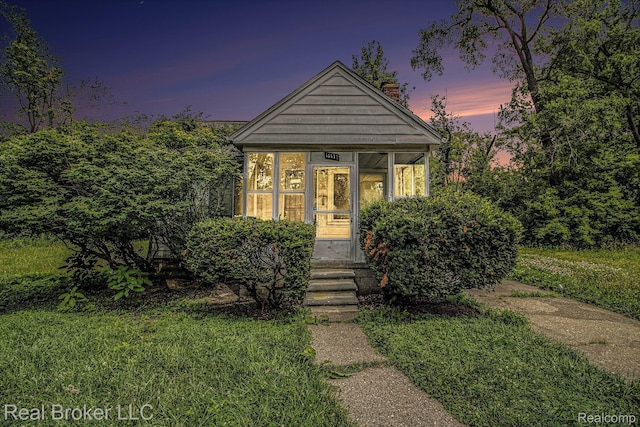 13576 Warwick St, Detroit, MI 48223 - view of front facade with a sunroom