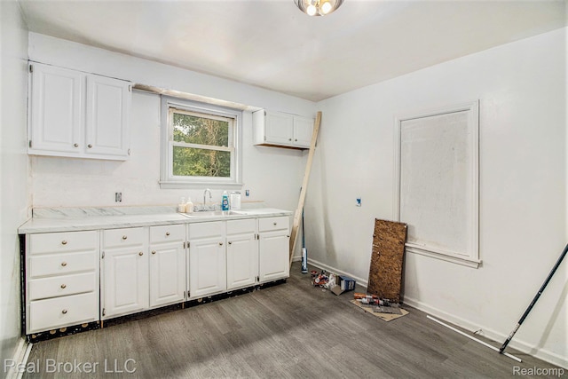 13576 Warwick St, Detroit, MI 48223 - kitchen with dark wood finished floors and white cabinetry