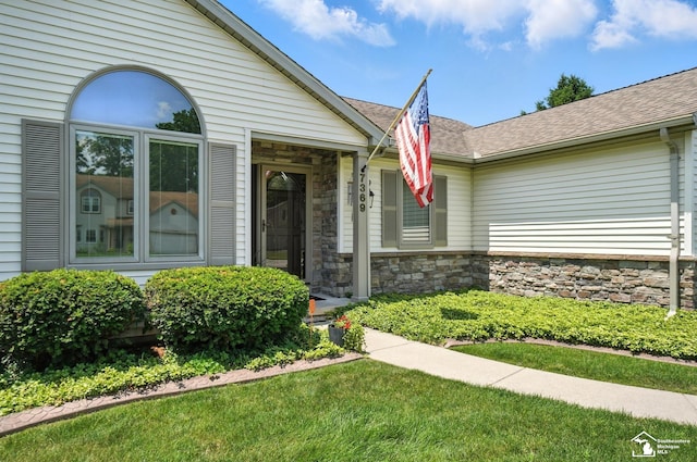 7369 Apple Grove Ln, Temperance, MI 48182 - entrance to property featuring stone siding and a shingled roof