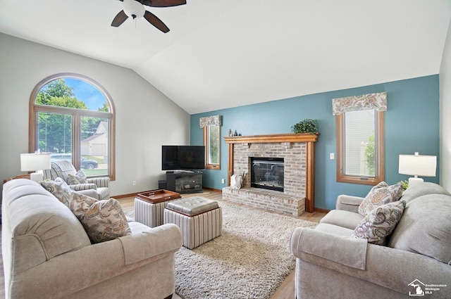 7369 Apple Grove Ln, Temperance, MI 48182 - living area with a ceiling fan, vaulted ceiling, wood finished floors, and a fireplace