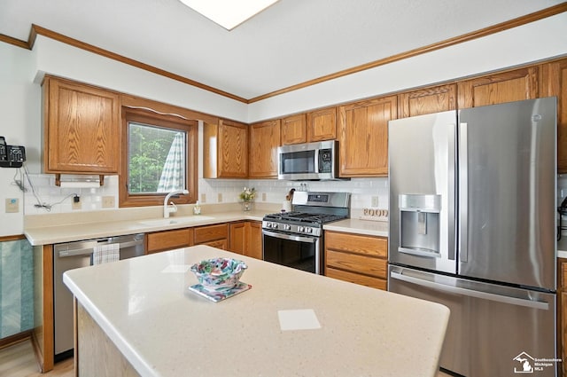 7369 Apple Grove Ln, Temperance, MI 48182 - kitchen featuring stainless steel appliances, crown molding, light countertops, brown cabinets, and tasteful backsplash