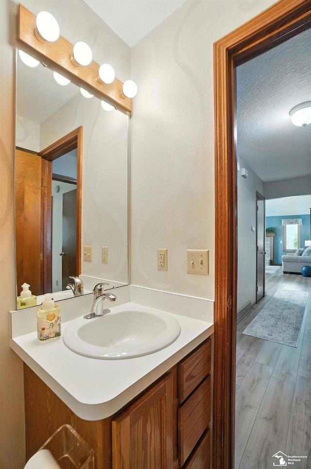 7369 Apple Grove Ln, Temperance, MI 48182 - bathroom with vanity and wood finished floors