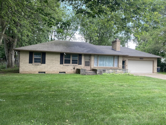 6832 Oakland Dr, Portage, MI 49024 - ranch-style home featuring brick siding, an attached garage, a chimney, and a front lawn