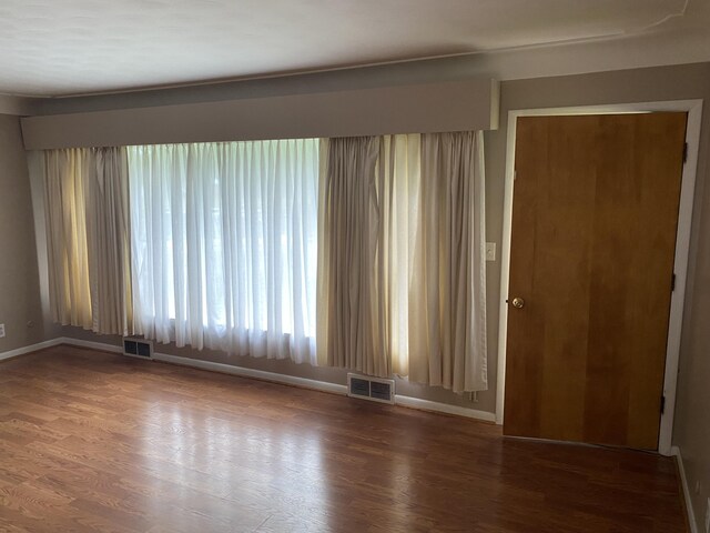 6832 Oakland Dr, Portage, MI 49024 - unfurnished room with baseboards and wood finished floors