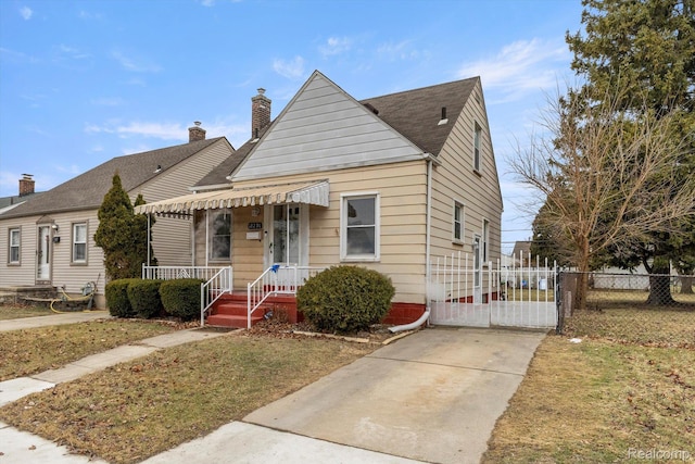 18291 Henry St, Melvindale, MI 48122 - bungalow-style house with a chimney, concrete driveway, and roof with shingles