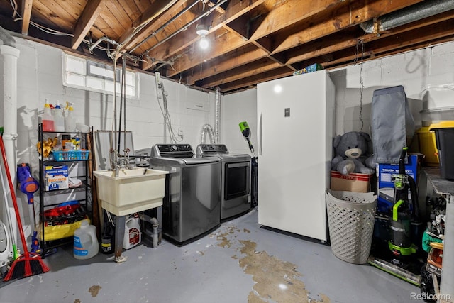 18291 Henry St, Melvindale, MI 48122 - basement with independent washer and dryer, concrete block wall, and freestanding refrigerator