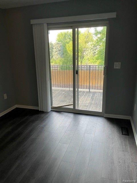 1530 Maryland Club Dr, Royal Oak, MI 48067 - spare room with healthy amount of natural light and wood finished floors