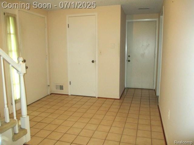 2667 Williamsburg Cir, Auburn Hills, MI 48326 - spare room featuring stairs and light tile patterned flooring