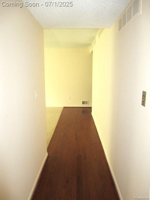 2667 Williamsburg Cir, Auburn Hills, MI 48326 - corridor featuring wood finished floors and a textured ceiling