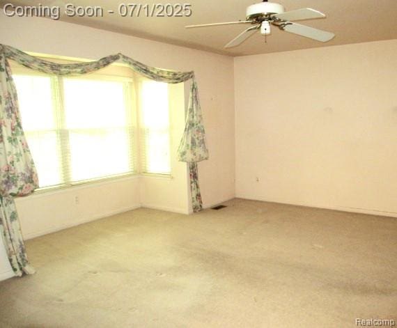 2667 Williamsburg Cir, Auburn Hills, MI 48326 - spare room featuring carpet floors and a ceiling fan