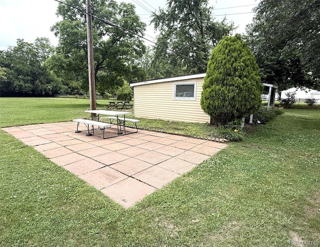 25830 Matilda Ave, Trenton, MI 48134 - view of community with a yard, a patio area, and an outdoor structure