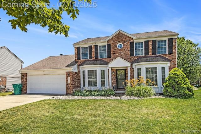 45209 Greenbriar Dr, Van Buren, MI 48111 - view of front facade featuring brick siding, an attached garage, a front yard, and concrete driveway