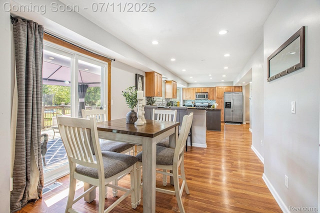 45209 Greenbriar Dr, Van Buren, MI 48111 - dining room featuring light wood finished floors and recessed lighting