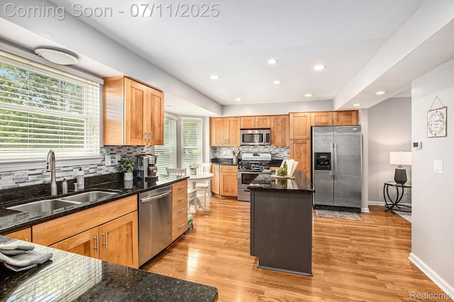 45209 Greenbriar Dr, Van Buren, MI 48111 - kitchen featuring stainless steel appliances, tasteful backsplash, a kitchen island, light wood-type flooring, and recessed lighting