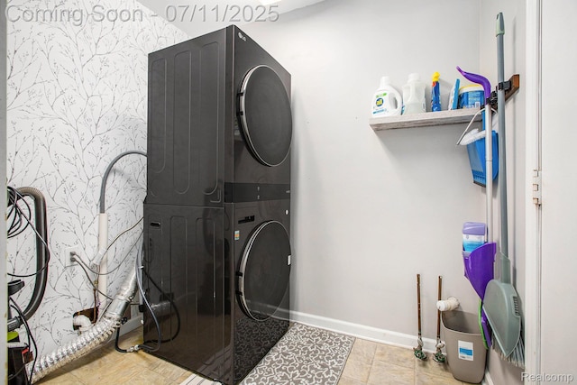 45209 Greenbriar Dr, Van Buren, MI 48111 - washroom featuring stacked washing machine and dryer and baseboards