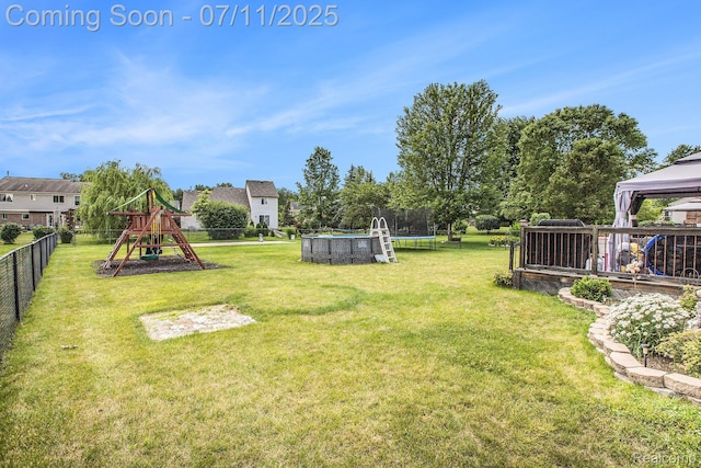 45209 Greenbriar Dr, Van Buren, MI 48111 - view of yard featuring a trampoline, a playground, and a gazebo