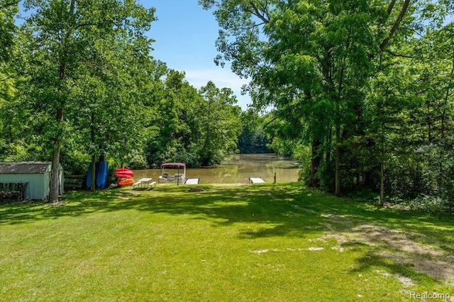 14165 Crampton Rd, Camden, MI 49232 - view of grassy yard featuring a storage unit