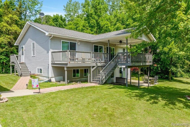 14165 Crampton Rd, Camden, MI 49232 - view of front of home featuring stairs, a ceiling fan, a front lawn, and a deck