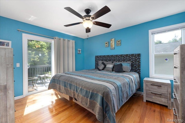 14165 Crampton Rd, Camden, MI 49232 - bedroom featuring access to exterior, wood finished floors, and a ceiling fan