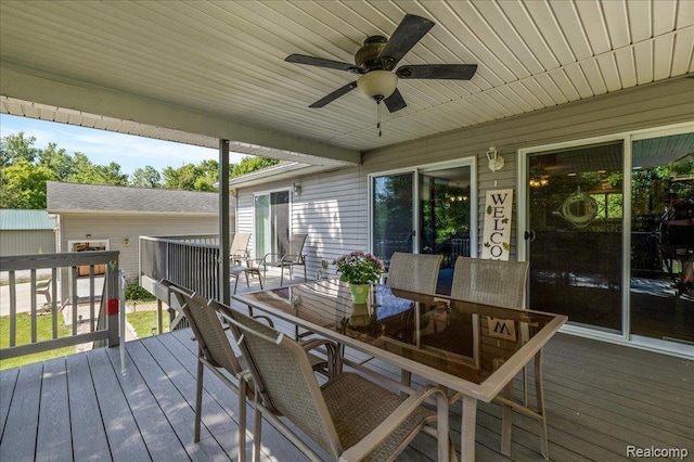 14165 Crampton Rd, Camden, MI 49232 - wooden terrace with outdoor dining space and a ceiling fan