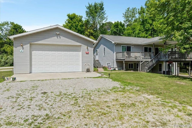 14165 Crampton Rd, Camden, MI 49232 - view of front of property with stairway, a wooden deck, a front lawn, and a garage