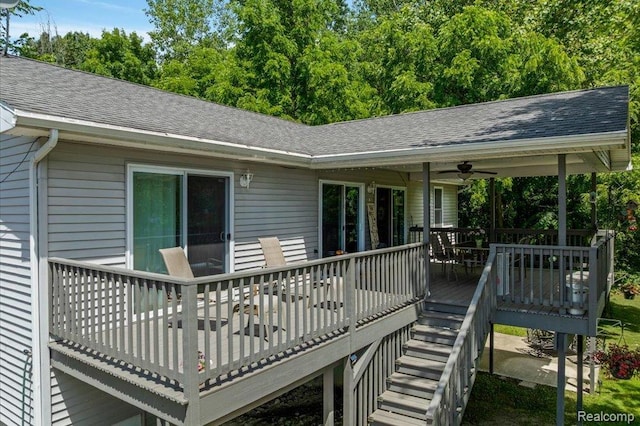 14165 Crampton Rd, Camden, MI 49232 - wooden terrace with a ceiling fan and stairway
