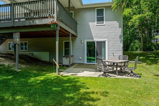 14165 Crampton Rd, Camden, MI 49232 - back of house with a lawn, a patio area, and a deck
