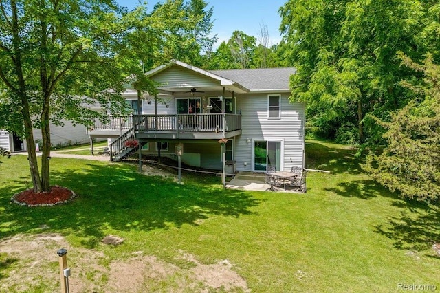 14165 Crampton Rd, Camden, MI 49232 - rear view of property featuring ceiling fan, a wooden deck, a yard, and a patio
