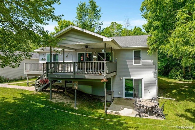 14165 Crampton Rd, Camden, MI 49232 - rear view of house with a lawn, a deck, a patio area, and stairs