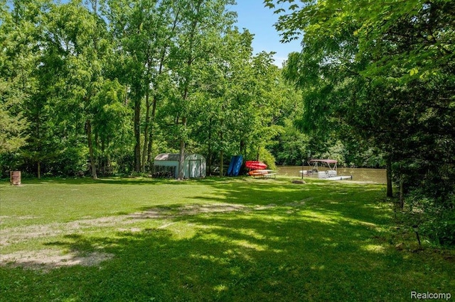 14165 Crampton Rd, Camden, MI 49232 - view of green lawn featuring a shed