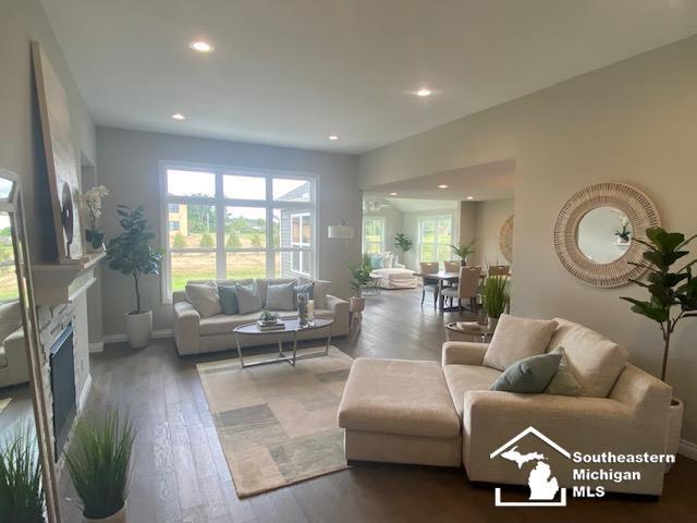 8260 Grande Lake Cir, Temperance, MI 48182 - living room featuring recessed lighting, wood finished floors, and a fireplace